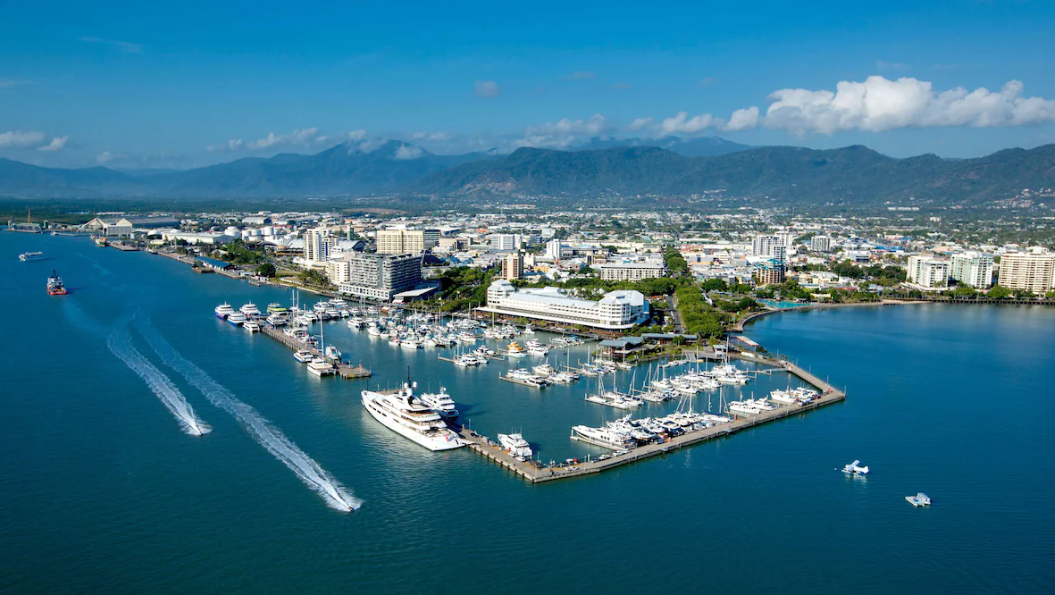 Aerial view of Cairns Marina with boats and city skyline